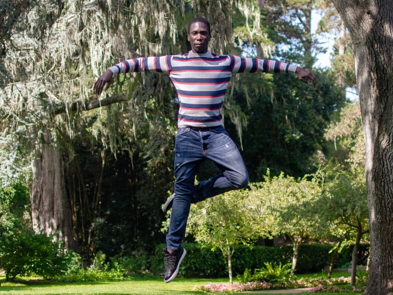 Brandon Alexander jumping high in Golden Gate Park, photo by Maggie Carey