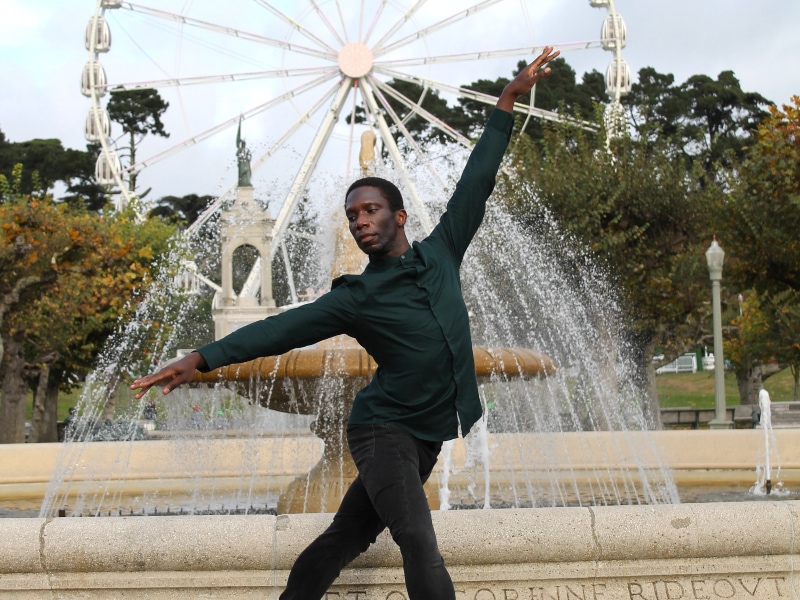Brandon Alexander looking elegant in front of a fountain near the De Young Museum, photo by Terez Dean Orr