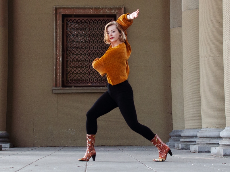 Cassidy dancing outside in cool boots.