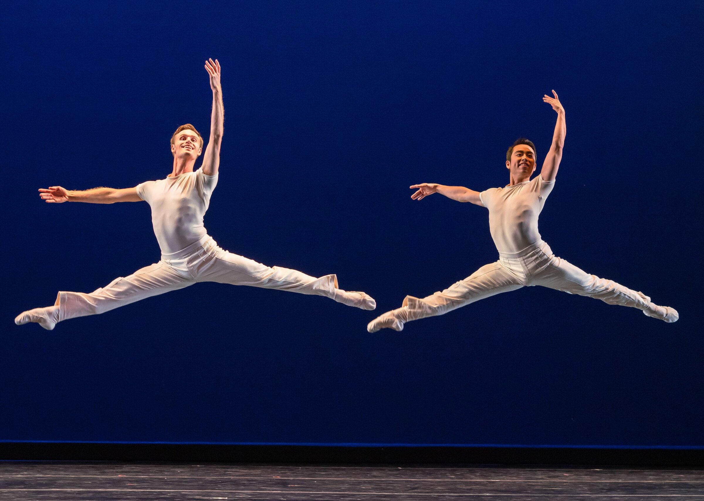 Ian and Meng jumping together photo by Chris Hardy