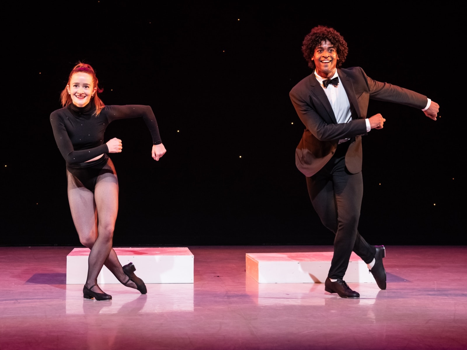 Maggie and Ricky dancing together in tap shoes