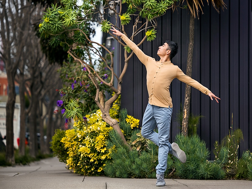 Meng dancing in front of cute garden.