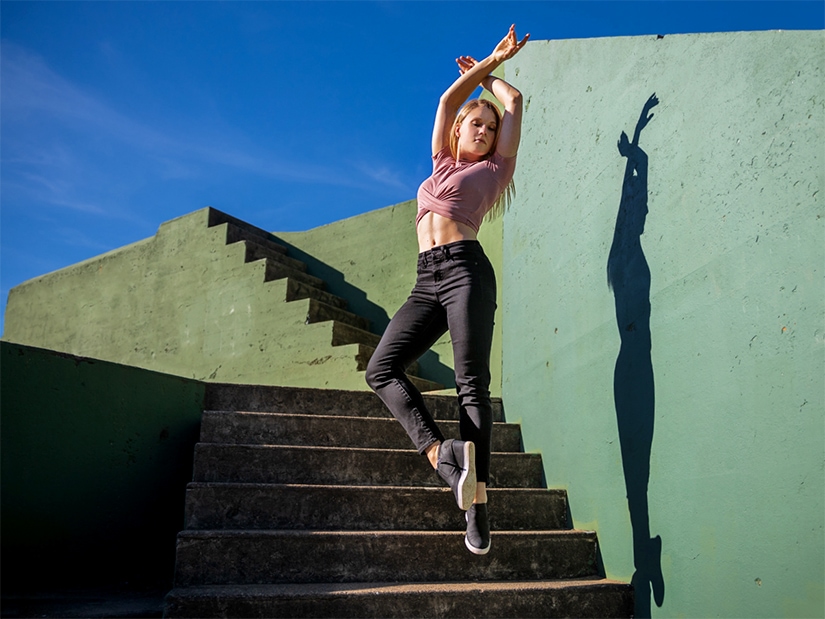 Tessa jumping off stairs. Photo by Chris Hardy