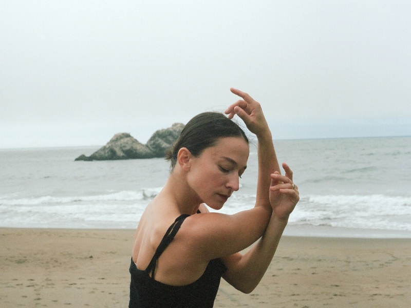 Terez posing on the beach.