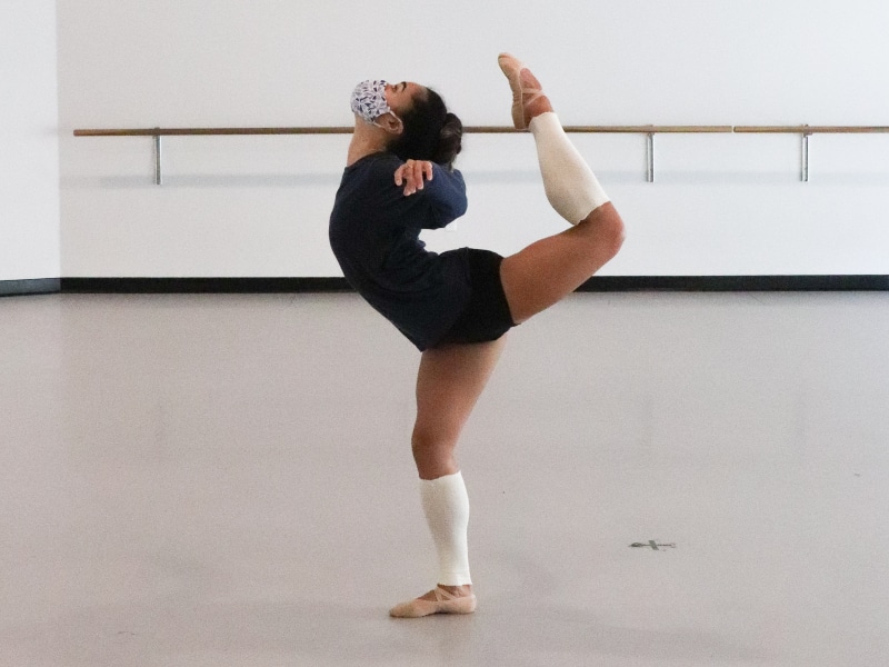 Tess showing off her flexibility to the back in the studio.