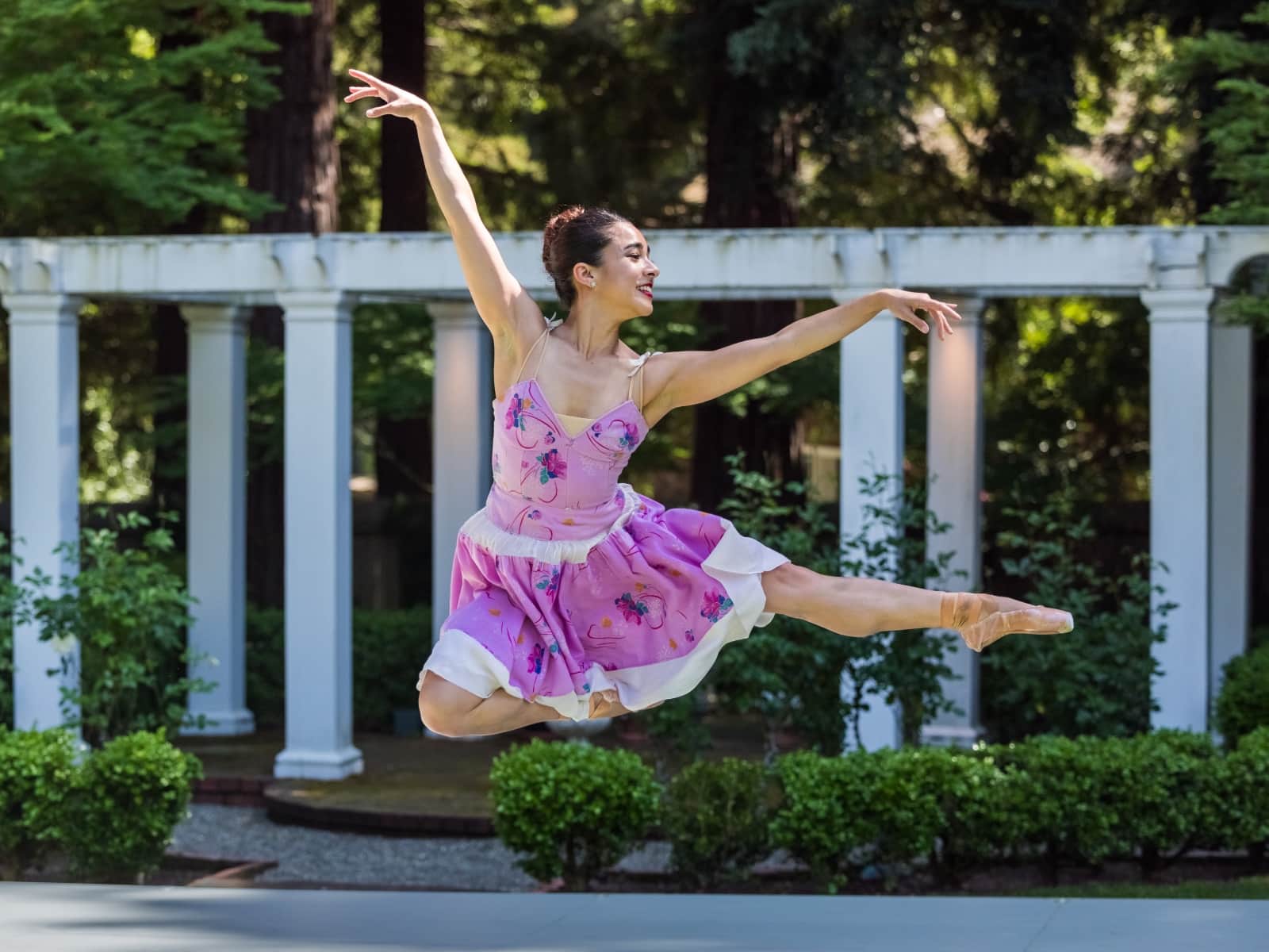 Tess jumping through the air and looking elegant.